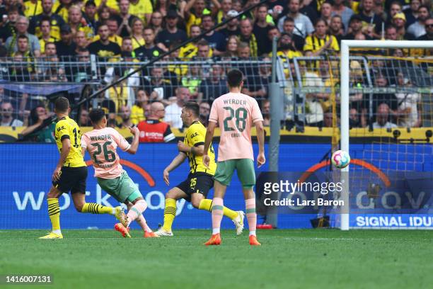 Lee Buchanan of SV Werder Bremen scores their team's first goal during the Bundesliga match between Borussia Dortmund and SV Werder Bremen at Signal...