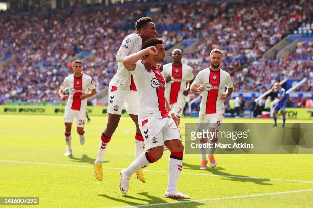 Che Adams of Southampton celebrates after scoring their team's first goal during the Premier League match between Leicester City and Southampton FC...