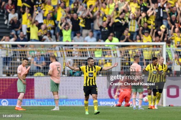 Raphael Guerreiro of Borussia Dortmund celebrates after scoring their team's second goal during the Bundesliga match between Borussia Dortmund and SV...