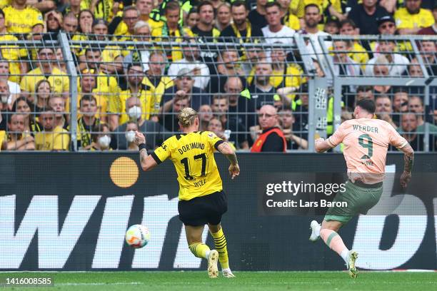 Oliver Burke of SV Werder Bremen scores their team's third goal during the Bundesliga match between Borussia Dortmund and SV Werder Bremen at Signal...