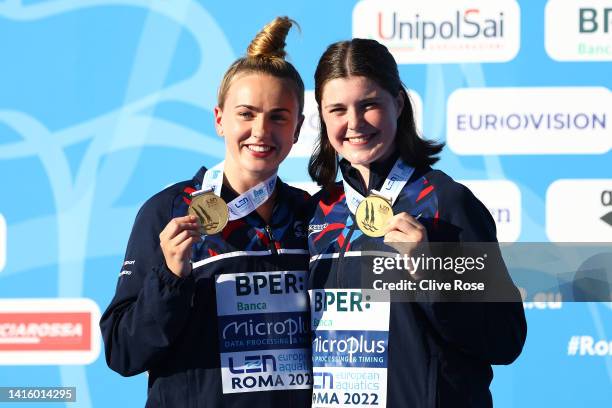 Andrea Spendolini Sirieix and Lois Toulson of Great Britain receive their Gold medals on the podium after winning the Women's Synchronised Platform...