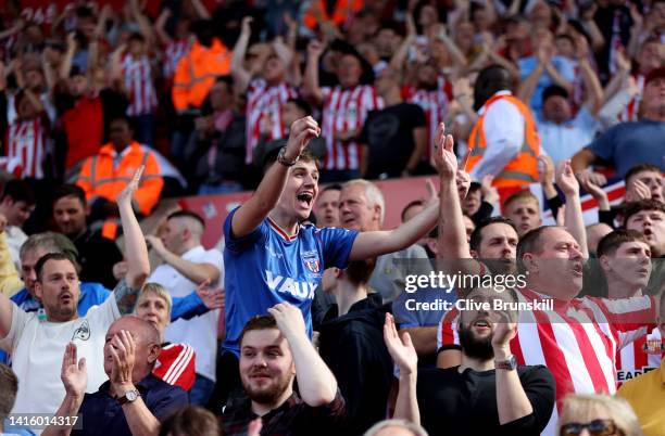 Sunderland fans celebrate after their team score the first goal during the Sky Bet Championship between Stoke City and Sunderland at Bet365 Stadium...