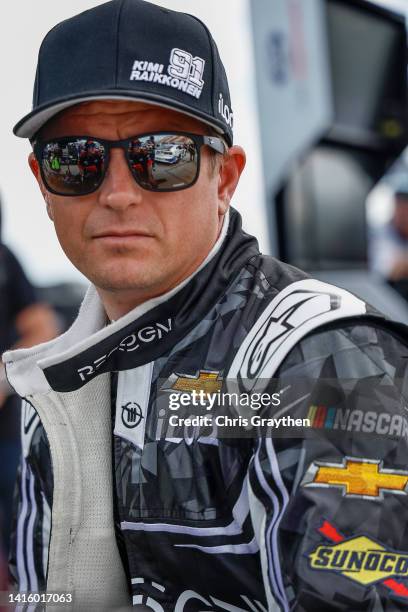 Kimi Raikkonen, driver of the Recogni Chevrolet, waits in the garage area during practice for the NASCAR Cup Series Go Bowling at The Glen at Watkins...