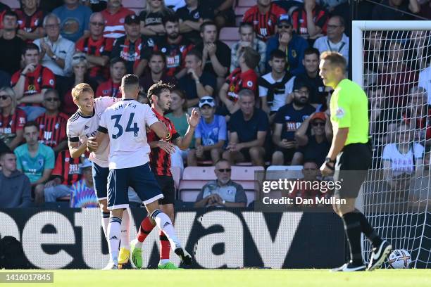 Martin Odegaard of Arsenal celebrates their sides second goal with team mate Granit Xhaka during the Premier League match between AFC Bournemouth and...