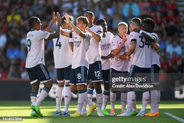 Martin Odegaard of Arsenal celebrates their sides second goal with team mate Gabriel Jesus during the Premier League match between AFC Bournemouth...