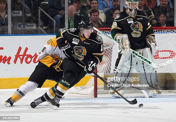 Olli Maatta of the London Knights skates away with the puck in a game against the Sarnia Sting on March 16, 2012 at the John Labatt Centre in London,...