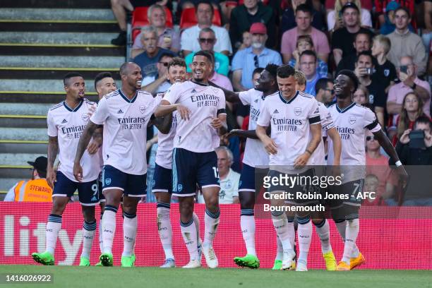 William Saliba of Arsenal celebrates with team-matesafter he scores a goal to make it 3-0 during the Premier League match between AFC Bournemouth and...