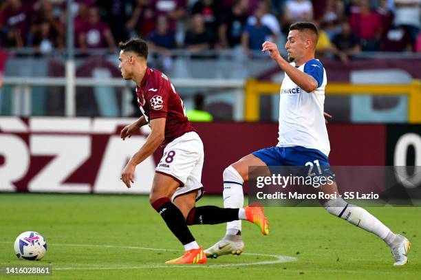 Sergej Milinkovic Savic of SS Lazio compete for the ball with Samuele Ricci during the Serie A match between Torino FC and SS Lazio at Stadio...