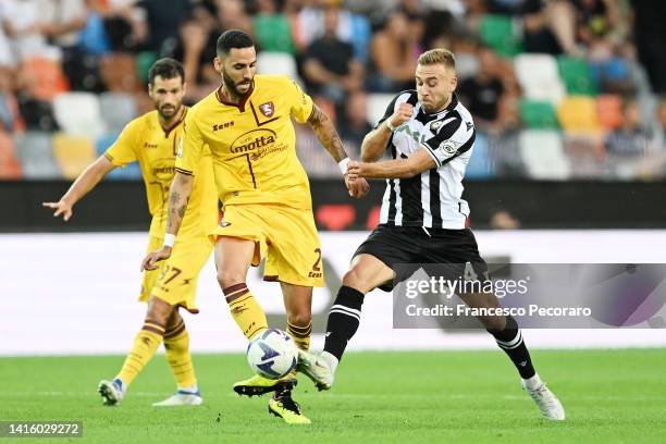 Sandi Lovric of Udinese Calcio vies with Dylan Bronn of Salernitana during the Serie A match between Udinese Calcio and Salernitana at Dacia Arena on...