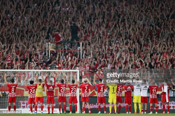Union Berlin players applaud the fans following their victory of the Bundesliga match between 1. FC Union Berlin and RB Leipzig at Stadion an der...