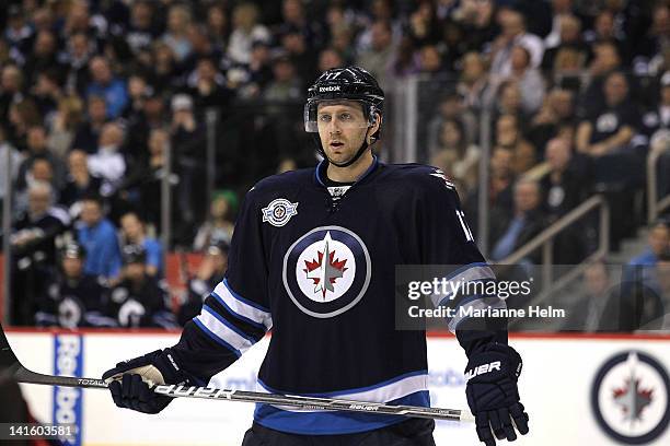 Eric Fehr of the Winnipeg Jets watches players get ready for a faceoff in a game against the Washington Capitals in NHL action at the MTS Centre on...