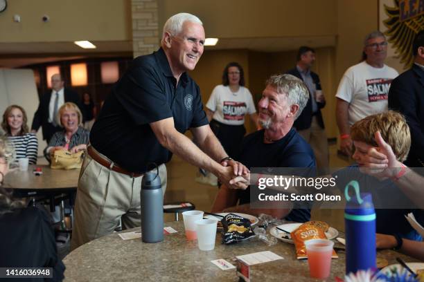 Former Vice President Mike Pence greets guests at the Bremer County Republicans' Grill and Chill lunch on August 20, 2022 in Waverly, Iowa. Pence was...