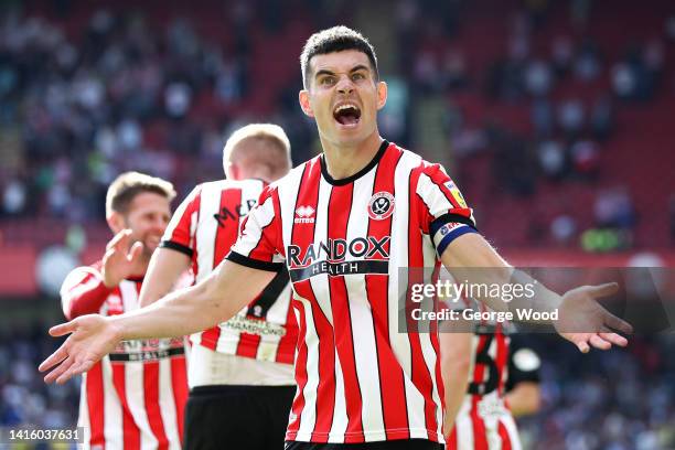 John Egan of Sheffield United celebrates the third goal scored by teammate Iliman Ndiaye during the Sky Bet Championship between Sheffield United and...