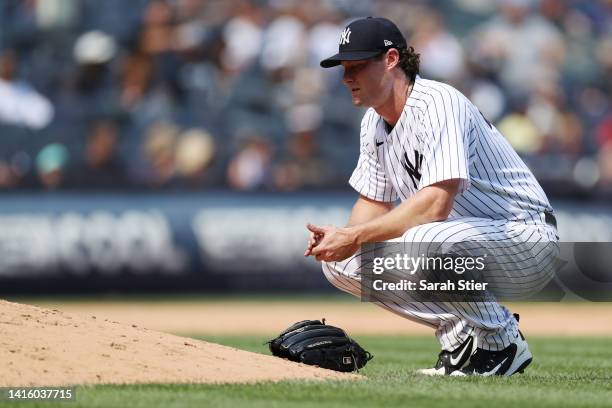 Gerrit Cole of the New York Yankees reacts while pitching during the fifth inning against the Toronto Blue Jays at Yankee Stadium on August 20, 2022...