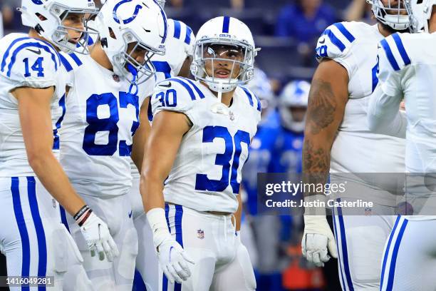 Phillip Lindsay of the Indianapolis Colts looks up at the score board during the first quarter in the preseason game against the Detroit Lions at...