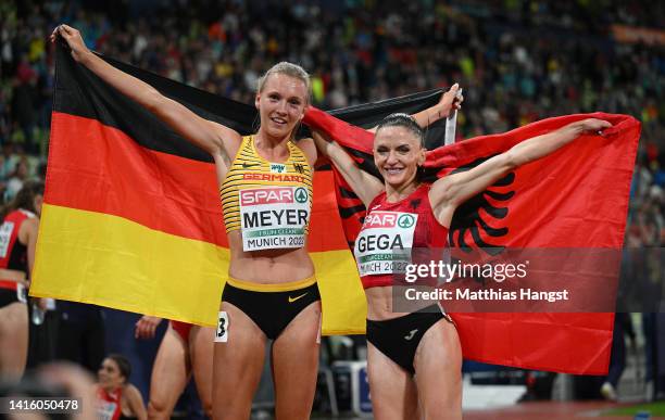 Silver medalist Lea Meyer of Germany and Gold medalist Luiza Gega of Albania celebrate after the Athletics - Women's 3000m Steeplechase Final on day...