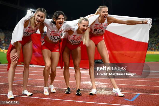Silver medalists Natalia Kaczmarek, Anna Kielbasinska, Justyna Swiety-Ersetic and Iga Baumgart-Witan of Poland celebrate after the Athletics -...