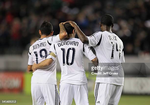 Juninho, Landon Donovan and Edson Buddle of the Los Angeles Galaxy celebrate a goal against Toronto FC during a CONCACAF Champions League game at The...