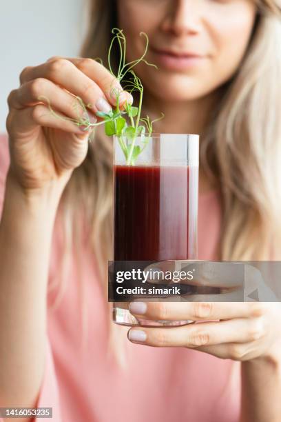 drinking micro greens - beetroot smoothie stock pictures, royalty-free photos & images