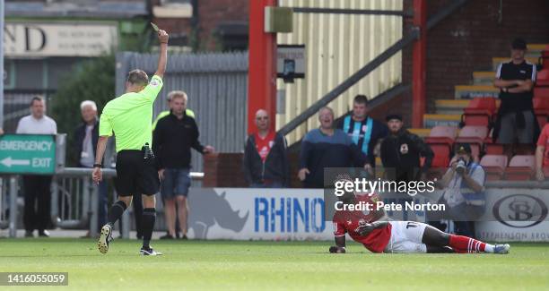 Dan Agyei of Crewe Alexandra is shown a yellow card by referee David Webb during the Sky Bet League Two between Crewe Alexandra and Northampton Town...