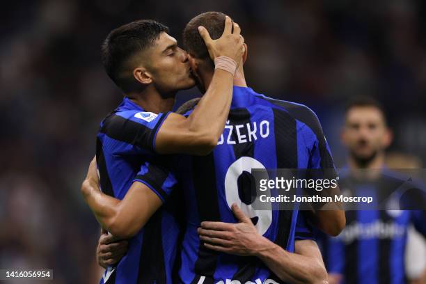 Joaquin Correa of FC Internazionale kisses team mate Edin Dzeko as he celebrates after scoring to give the side a 3-0 lead during the Serie A match...