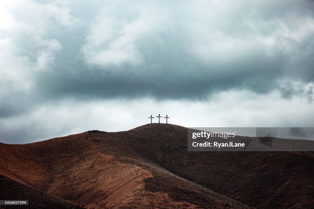 Three Crosses on Dark Hillside