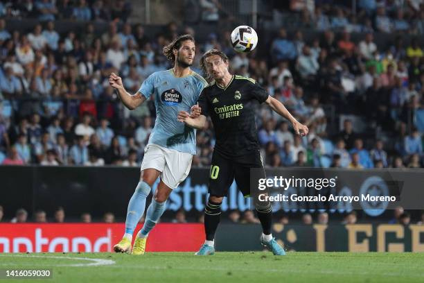 Luka Modric of Real Madrid CF wins the header after Goncalo Paciencia of RC Celta de Vigo during the LaLiga Santander match between RC Celta de Vigo...