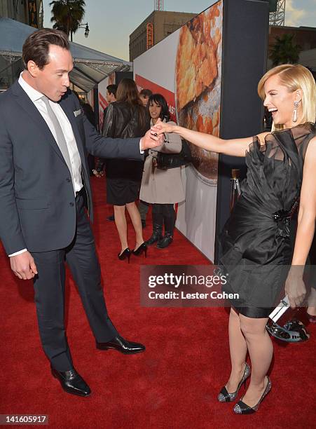 Actors Chris Klein and Mena Suvari arrive at the "American Reunion" Los Angeles Premiere March 19, 2012 in Hollywood, California.