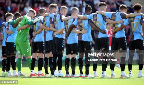 Northampton Town players line up prior to the Sky Bet League Two between Crewe Alexandra and Northampton Town at Mornflake Stadium on August 20, 2022...