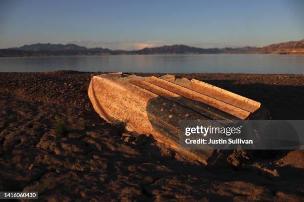 Previously sunken boat sits on the banks of Lake Mead on August 19, 2022 in Lake Mead National Recreation Area, Nevada. The federal government...