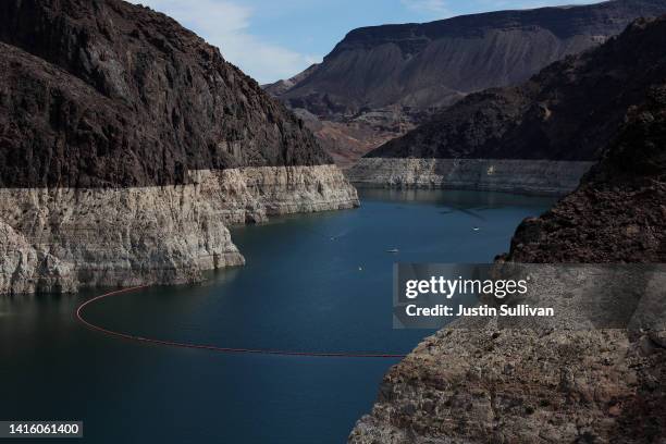 Bleached 'bathtub ring' is visible on the banks of Lake Mead near the Hoover Dam on August 19, 2022 in Lake Mead National Recreation Area, Arizona....