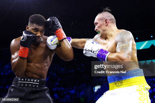 Oleksandr Usyk punches Anthony Joshua during their World Heavyweight Championship fight during the Rage on the Red Sea Heavyweight Title Fight at...