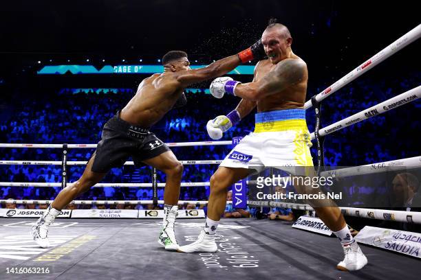 Anthony Joshua punches Oleksandr Usyk during their World Heavyweight Championship fight during the Rage on the Red Sea Heavyweight Title Fight at...