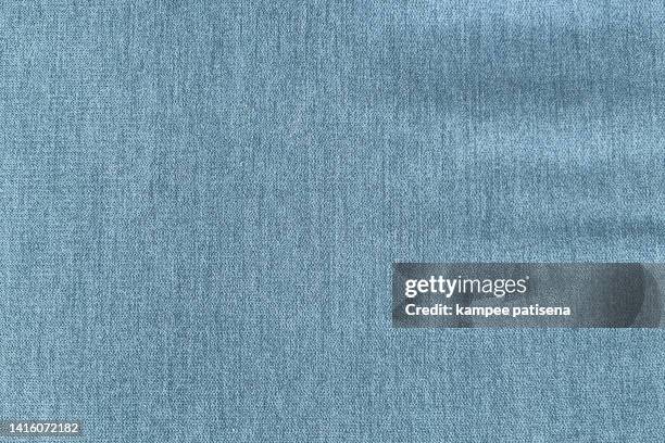 close up blue fabric texture. textile background. - spijkerstof stockfoto's en -beelden