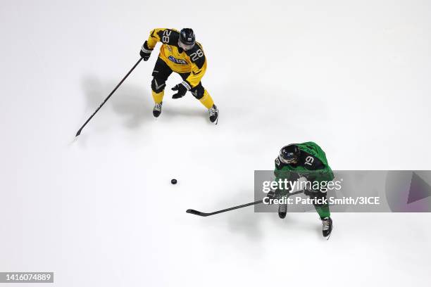 Chris Mueller of Team Murphy skates with the puck against Kevin Fitzgerald of Team Mullen in the semifinal game of the 2022 3ICE Playoffs for the...