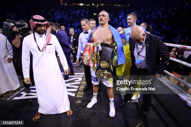 Oleksandr Usyk celebrates with their belts after their victory over Anthony Joshua in their World Heavyweight Championship fight during the Rage on...