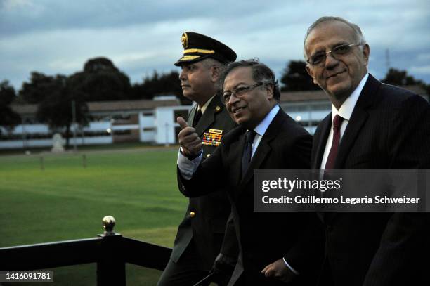 The newly elected president of Colombia Gustavo Petro gives the thumbs up sign accompanied by his Defense Minister Ivan Velasquez and Colombia's...