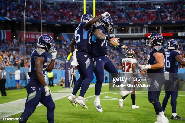 Chig Okonkwo of the Tennessee Titans celebrates after catching a pass to score a touchdown against the Tampa Bay Buccaneers at the end of the second...