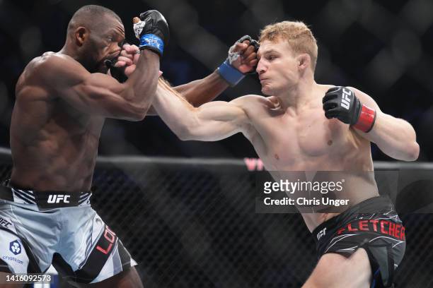 Fletcher punches Ange Loosa of Congo in a welterweight fight during the UFC 278 event at Vivint Arena on August 20, 2022 in Salt Lake City, Utah.