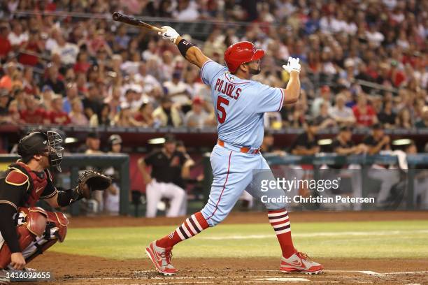 Albert Pujols of the St. Louis Cardinals hits a solo home run against the Arizona Diamondbacks during the second inning of the MLB game at Chase...