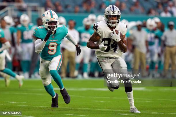 Keelan Cole of the Las Vegas Raiders runs upfield after making a catch in the first quarter against the Miami Dolphins at Hard Rock Stadium on August...