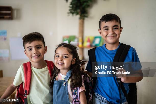 portrait of friends at school - tiny mexican girl stock pictures, royalty-free photos & images