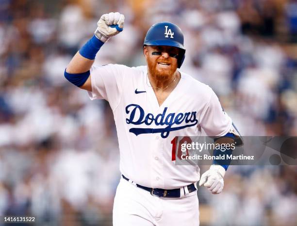 Justin Turner of the Los Angeles Dodgers celebrates a three-run home run against the Miami Marlins in the third inning at Dodger Stadium on August...