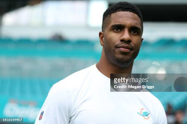 Byron Jones of the Miami Dolphins looks on during pregame warm-ups prior to playing the Las Vegas Raiders at Hard Rock Stadium on August 20, 2022 in...