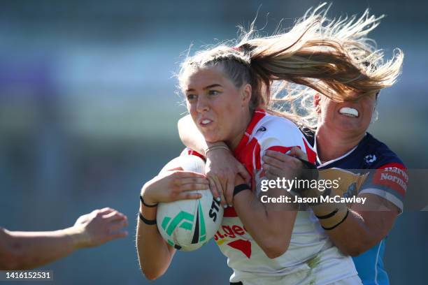 Teagan Berry of the Dragons is tackled during the round one NRLW match between St George Illawarra Dragons and Gold Coast Titans at WIN Stadium on...