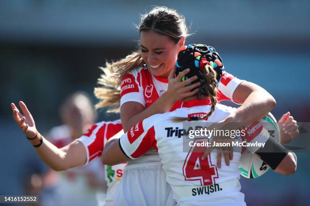 Page McGregor of the Dragons celebrates scoring a try with Taliah Fuimaono of the Dragons during the round one NRLW match between St George Illawarra...