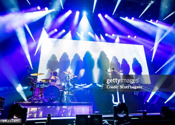 Josh Dun and Tyler Joseph of Twenty One Pilots perform during The ICY Tour at Little Caesars Arena on August 20, 2022 in Detroit, Michigan.