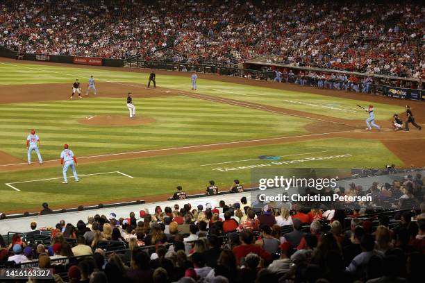Paul DeJong of the St. Louis Cardinals hits a grand slam against the Arizona Diamondbacks during the ninth inning of the MLB game at Chase Field on...
