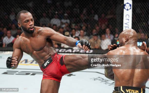 Leon Edwards of Jamaica lands a head kick to Kamaru Usman of Nigeria in the UFC welterweight championship fight during the UFC 278 event at Vivint...
