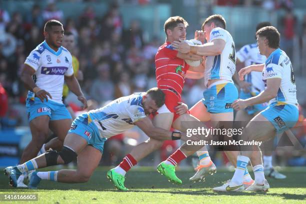 Zac Lomax of the Dragons is tackled during the round 23 NRL match between the St George Illawarra Dragons and the Gold Coast Titans at WIN Stadium on...